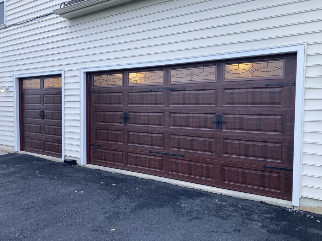 faux dark wood garage door with windows and hinges