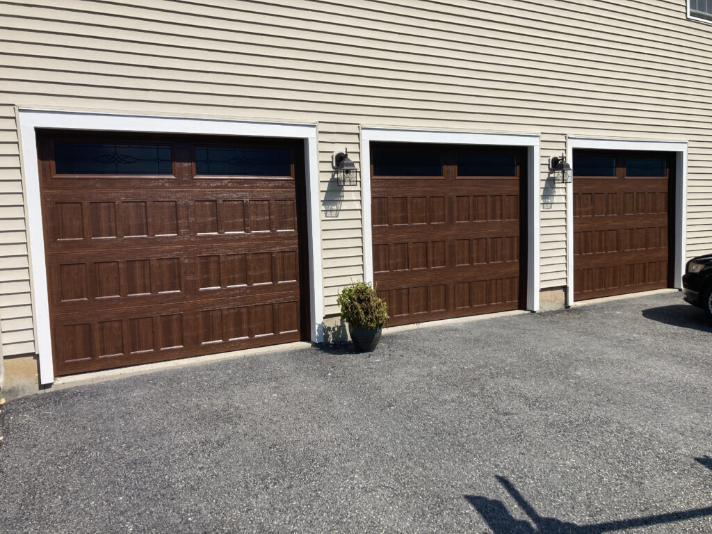 Faux wood short panel garage doors with windows